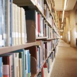 Library interior inside of library with book shelves close up looking down a hallway