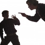 silouette of father yelling at son