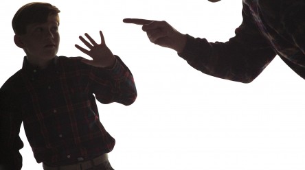 silouette of father yelling at son