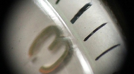 close up of face of watch at 3