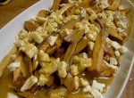 plate of poutine, canadian fries with gravy and cheese curds