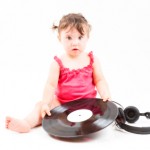 baby and vinyl record.