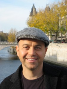 alan watt in hat in front of lake