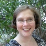 elizabeth webb in glasses in front of trees