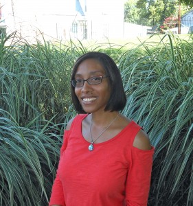 Kel Kennedy outside in tall grass