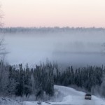 winter winding road in alaska mountains