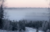 winter winding road in alaska mountains