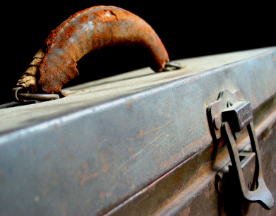 old metal tackle box with rusty handle