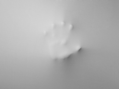 hand pushin a material to exit out