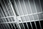 closed bars of jail cell