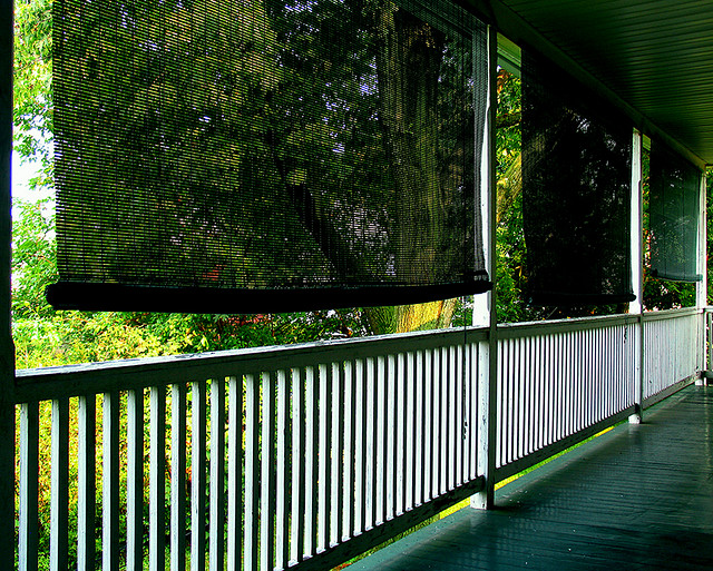 patio with posts and woods out back
