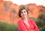 Jeanne Lyet Gassman with red rock mountains in back