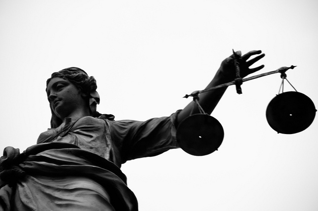 close up of justice statue and scales