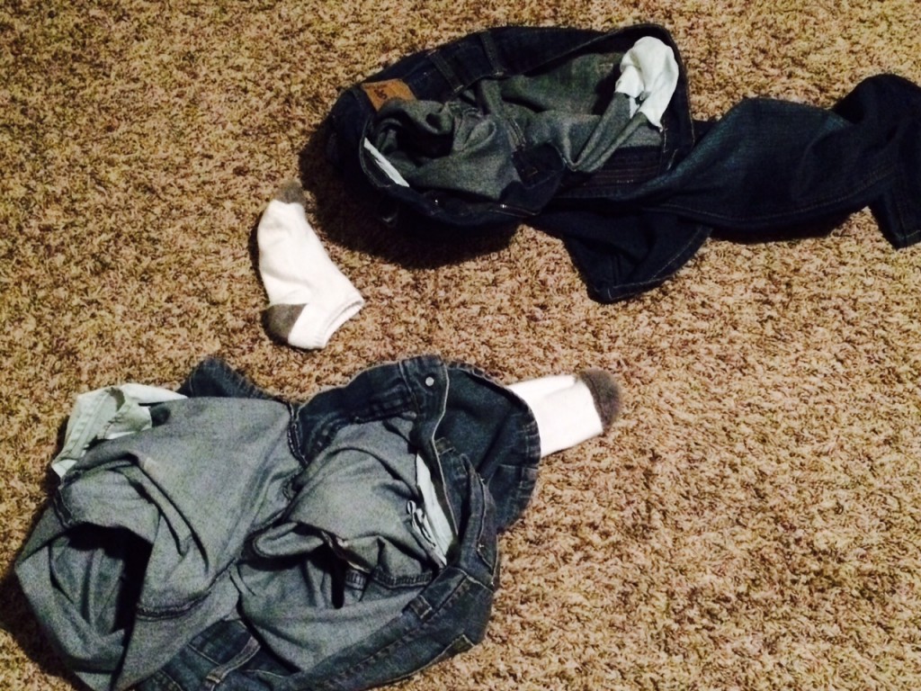 two pair of men's jeans on floor