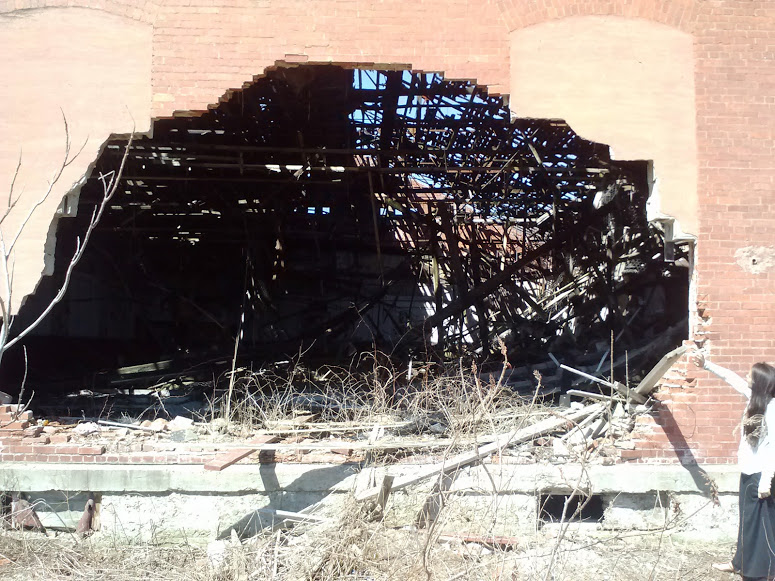 another angle of old roller rink with hole in wall