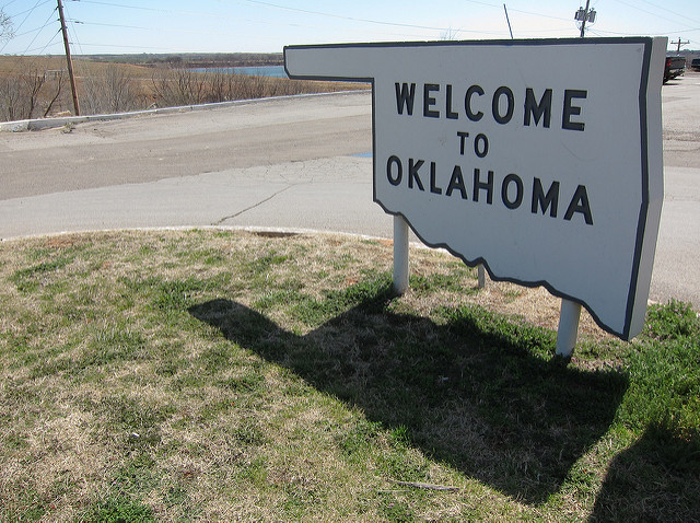 welcome to OK sign shaped like oklahoma (like a pan)