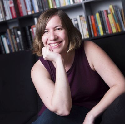 steph auteri in front of bookshelves
