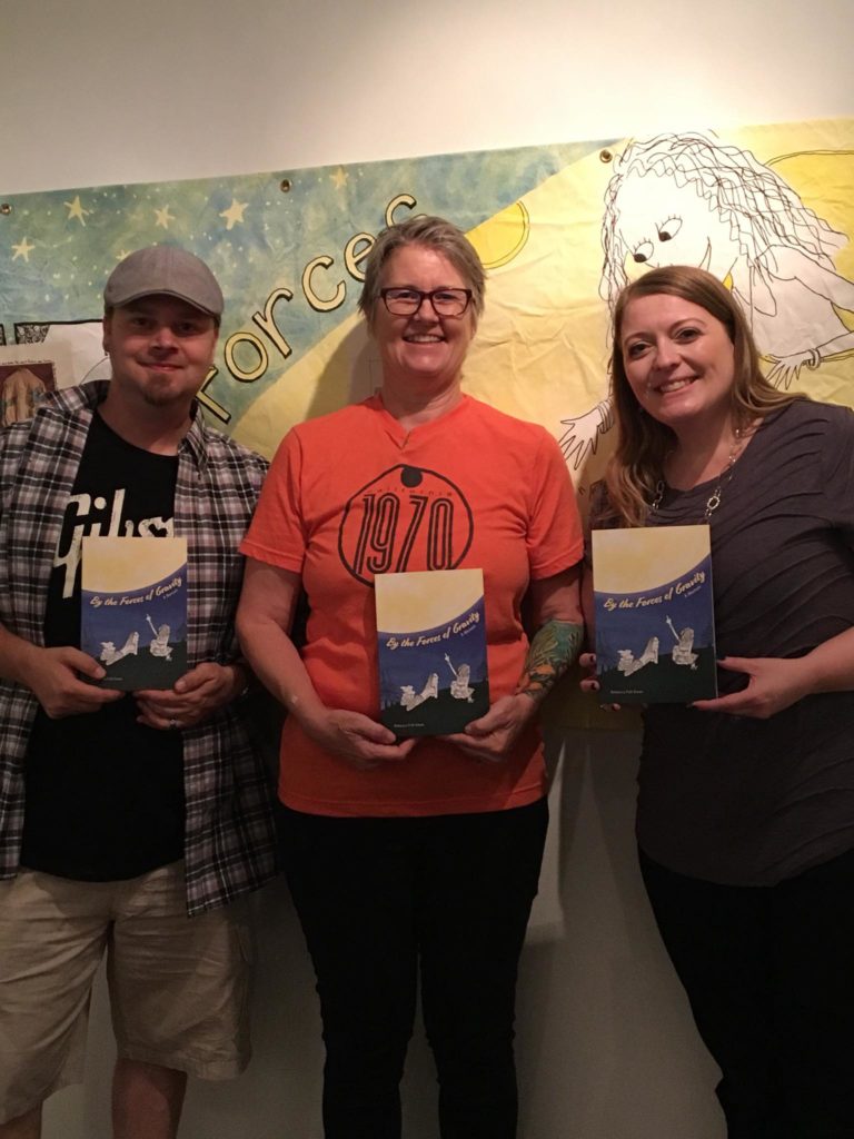 kevin, rebecca and donna holding rebeccas book