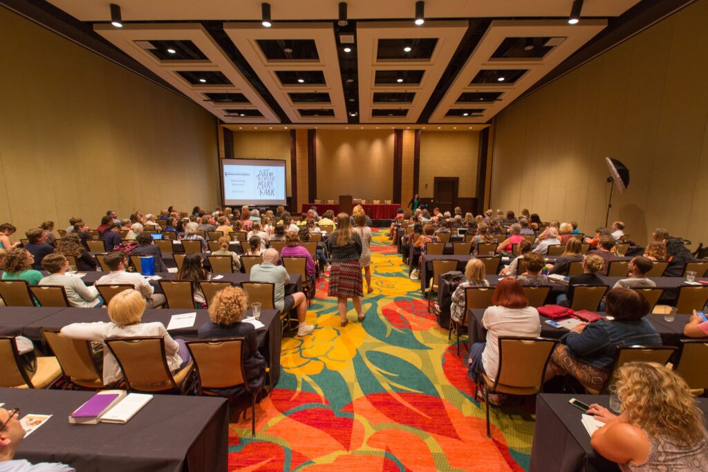 conference room full of people with aisle of people lined up to ask questions, from HippoCamp 2017