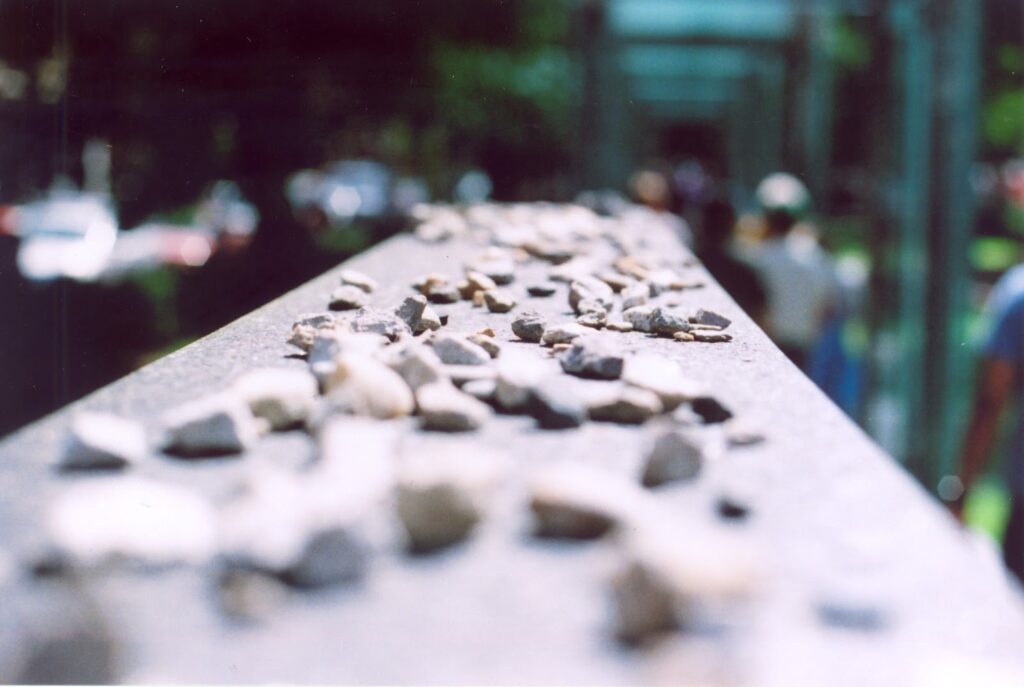 close up shot of small stones on a monument