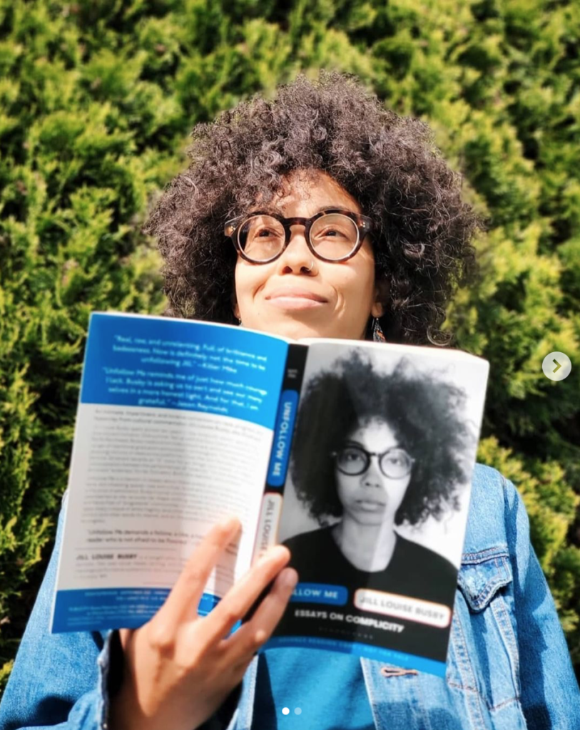 Instagram photo of Jill Louise Busby holding her book.