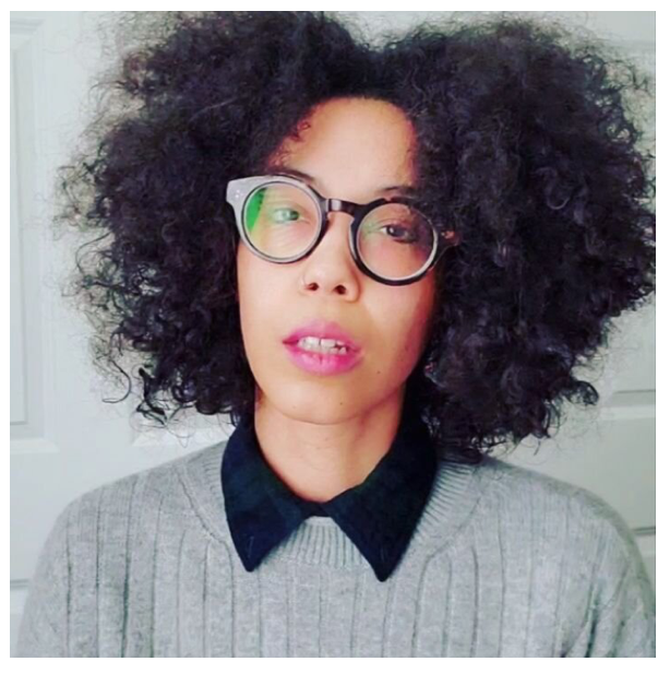 Author Jill Louise Busby in gray sweater.