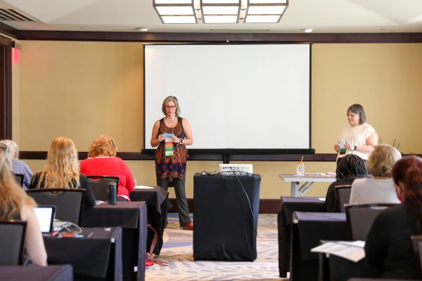 lara lillibridge and amy fish presenting in conference room