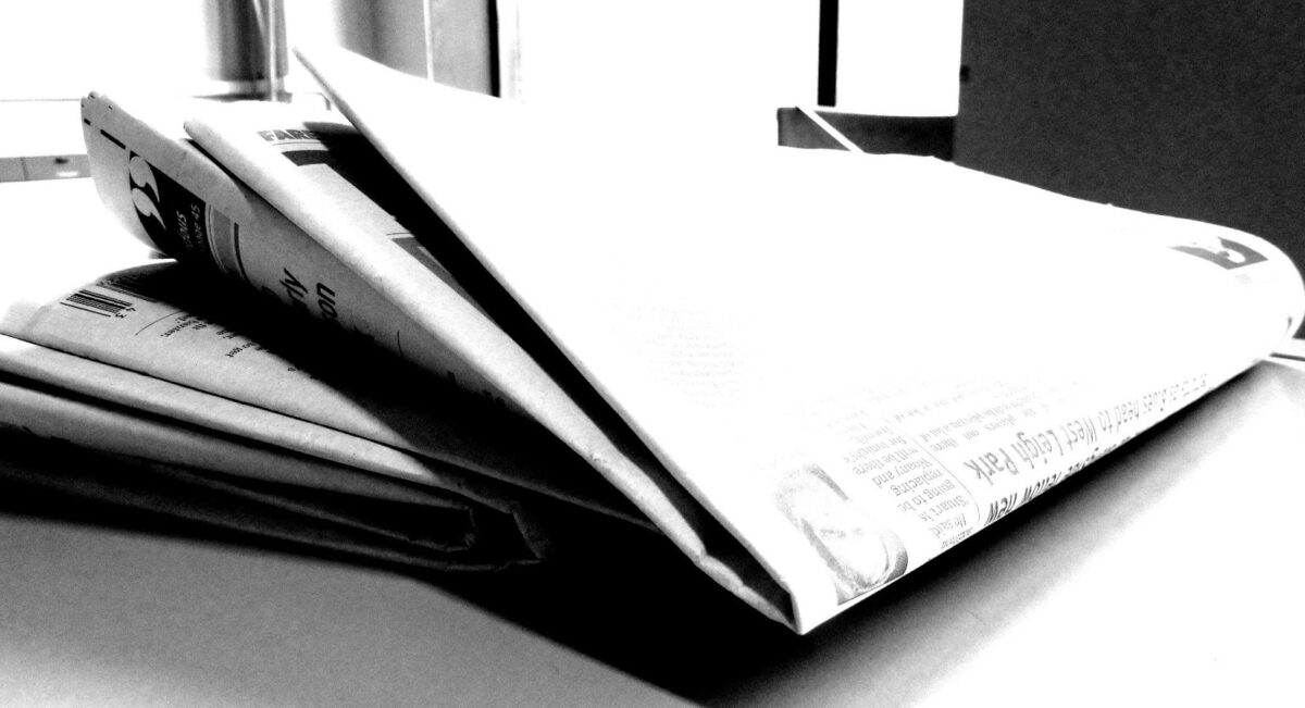 newspaper folder on a table