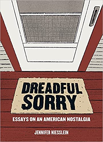 The book title Dreadful Sorry is seen on a welcome mat in front of a white door