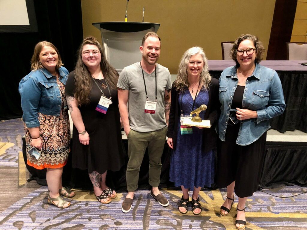 three hippocamp story slam winners -- Molly Bilinski, Brandon Arvesen and Lisa Ellison --posing with host JJ Sheffer and conference organizer Donna Talarico