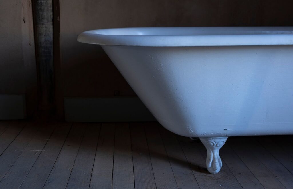 clawfoot tub on wooden floor