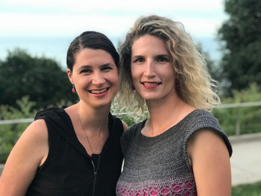 Daniella Mestyanek Young and brandi Larsen outside