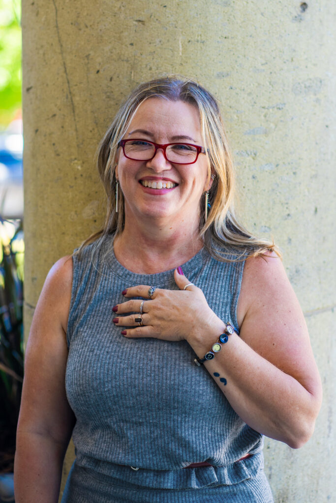 Photo of Julia Park Tracey, a white woman wearing glasses.