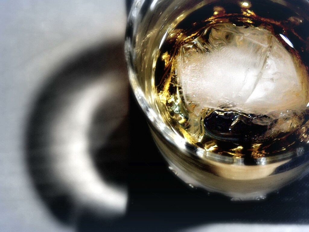 An Old Fashioned: A glass of alcohol with ice block