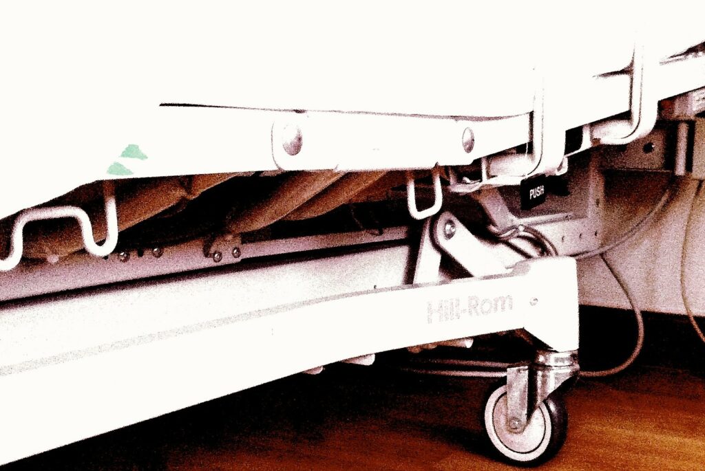 wheels of hospital bed on floor