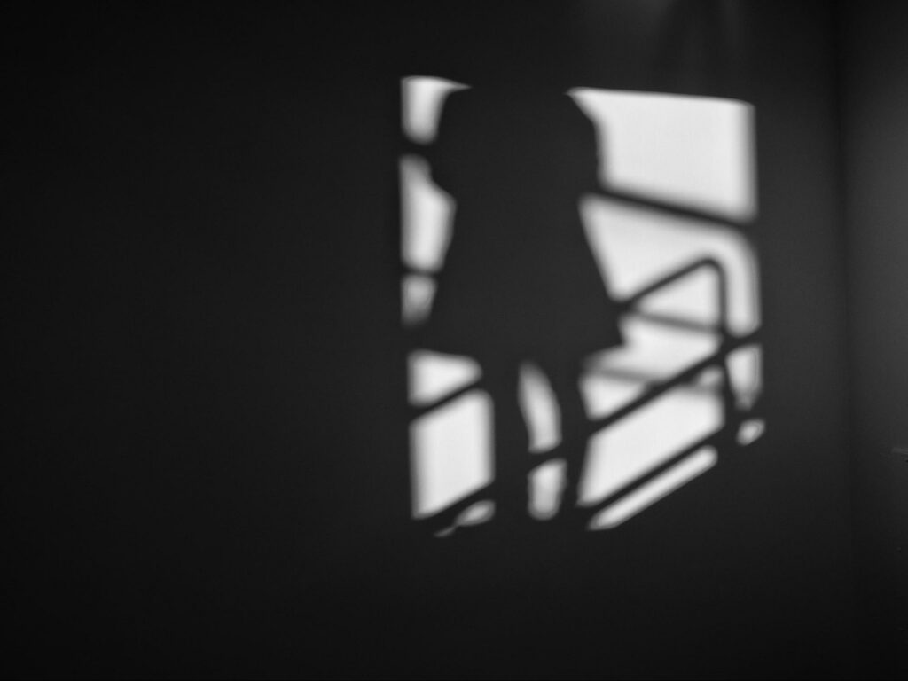 shadow of person in dress on stairwell