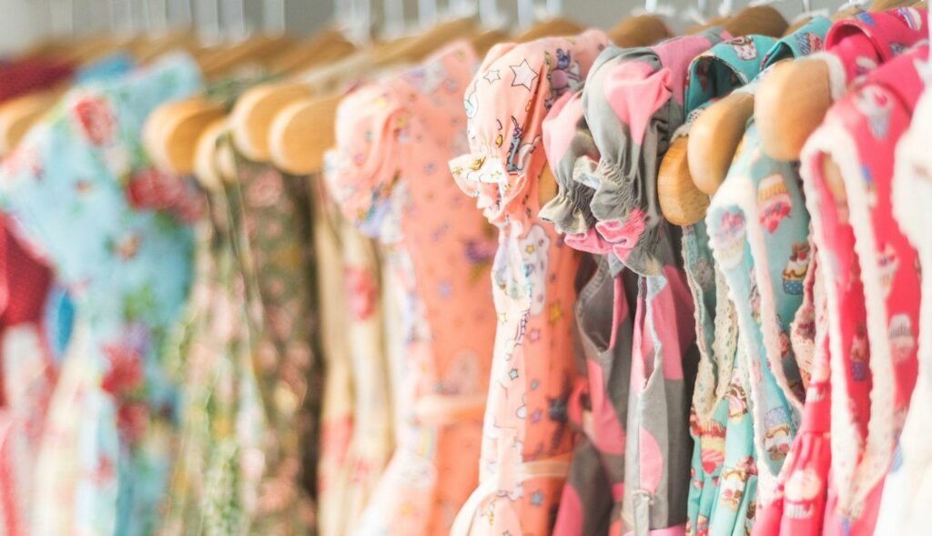 A group of clothes on hangers