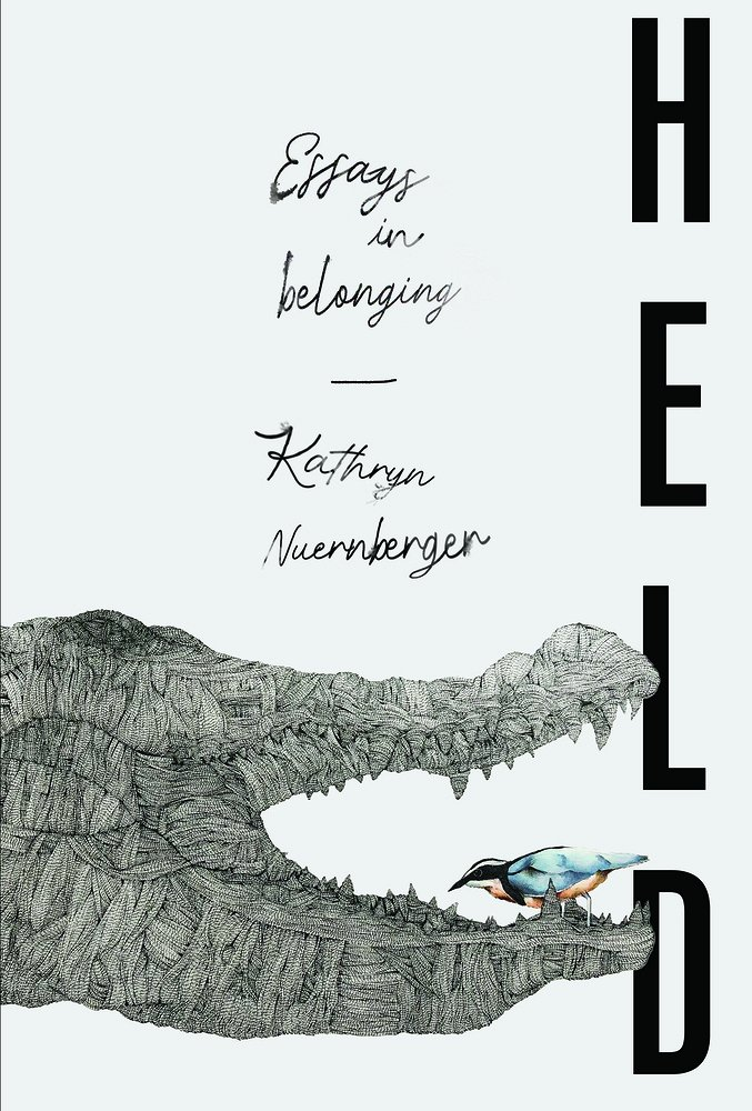 cover of Held cover Essays in Belonging by Kathryn Nuernberger; title in cursive handwriting with abstract sketch of alligator with bird in its mouth