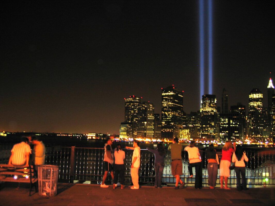 Two lights shining up in the sky, to resemble and honor the twin towers in NYC