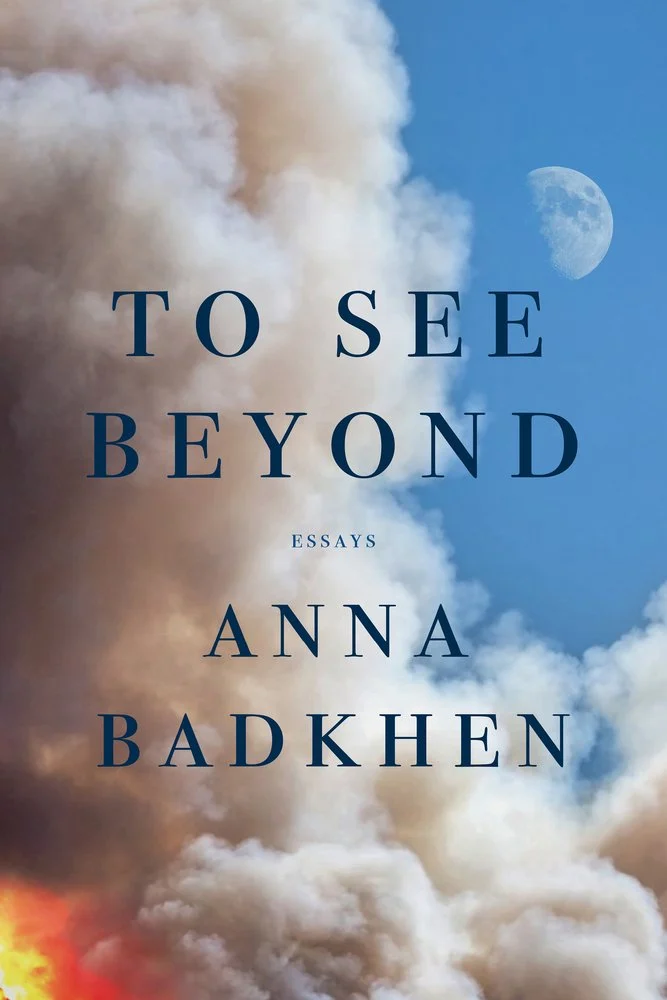 cover of To See Beyond by Anna Badkhen - smoke coming up from a fire with the moon in a blue sky in the distance