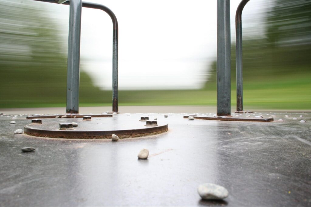 merry go round with blurry park in background to show spinning