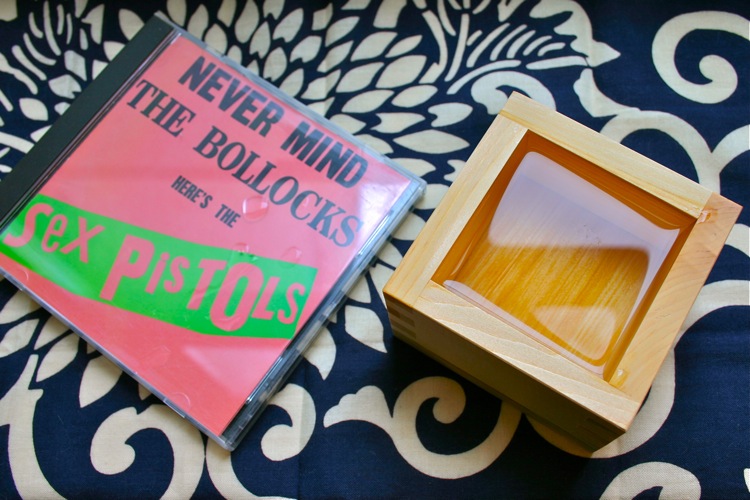 sex pistols CD and wooden box of sake