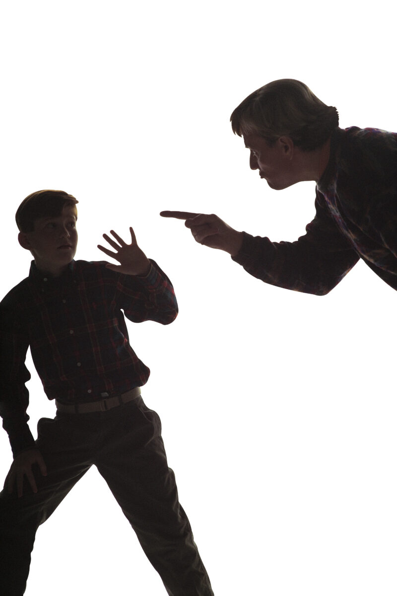 silouette of father yelling at son