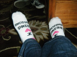 donna talarico's feet wearing socks that say I heart being awesome