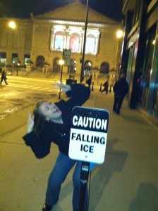 donna talarico with caution falling ice sign pretending it is falling on her from above