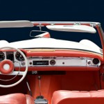 interior of an old convertible looking from backseat to steering wheel