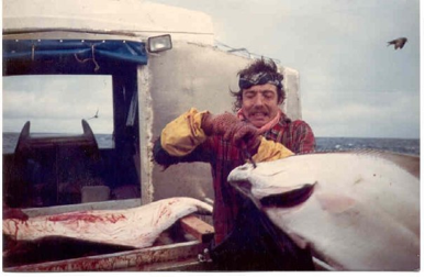 John unger fishing boat with large fish in alaska