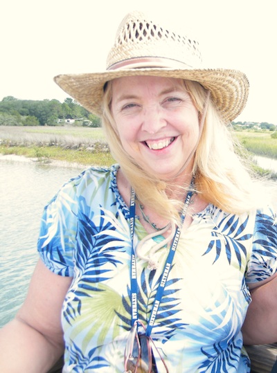 Wendy thornton wearing sun straw hat by fresh water
