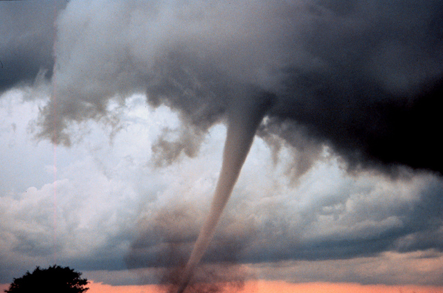 Tornado funnel over sunset