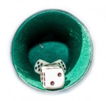 vintage yahtzee cup lined with felt with dice inside looking in